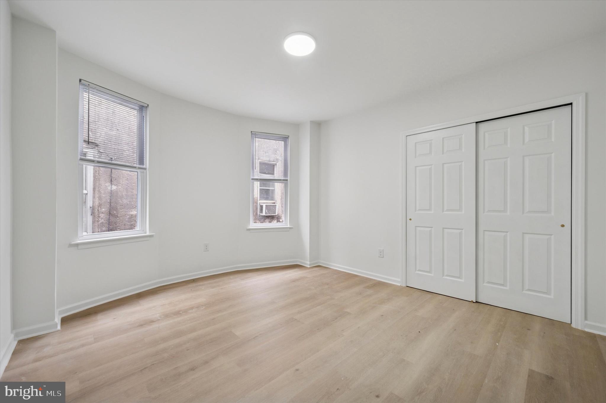 5431 Walnut Street, Unit 2 Philadelphia, PA 19139 - Photo 5 of 6 a view of an empty room with a window