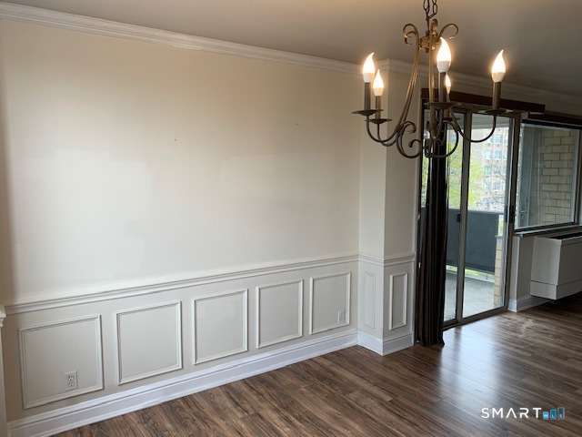 50 Glenbrook Road, Unit 5G Stamford, CT 06902 - Photo 14 of 40 a view of a livingroom with wooden floor and a ceiling fan