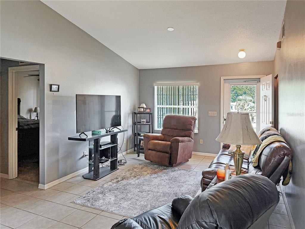 5730 Southeast 41st Street Ocala, FL 34480 - Photo 14 of 27 a view of a livingroom with furniture and windows