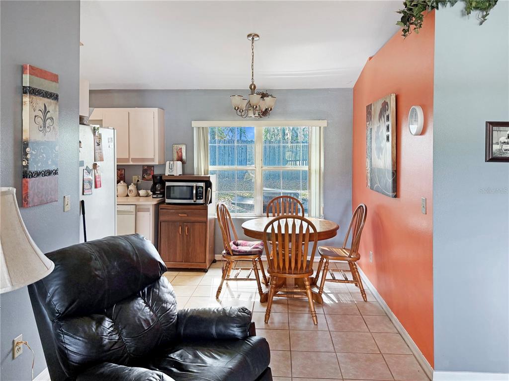 5730 Southeast 41st Street Ocala, FL 34480 - Photo 15 of 27 a living room with furniture and a window