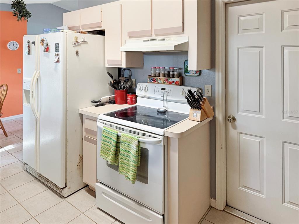 5730 Southeast 41st Street Ocala, FL 34480 - Photo 19 of 27 a kitchen with stainless steel appliances granite countertop a refrigerator and a sink