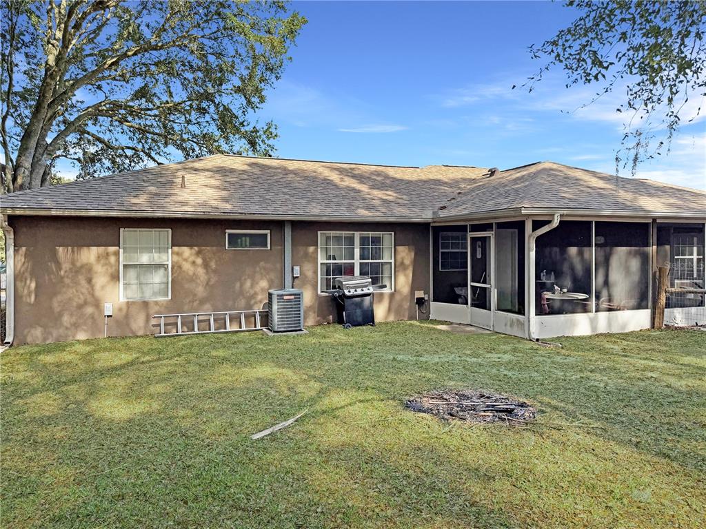 5730 Southeast 41st Street Ocala, FL 34480 - Photo 24 of 27 a front view of a house with a garden