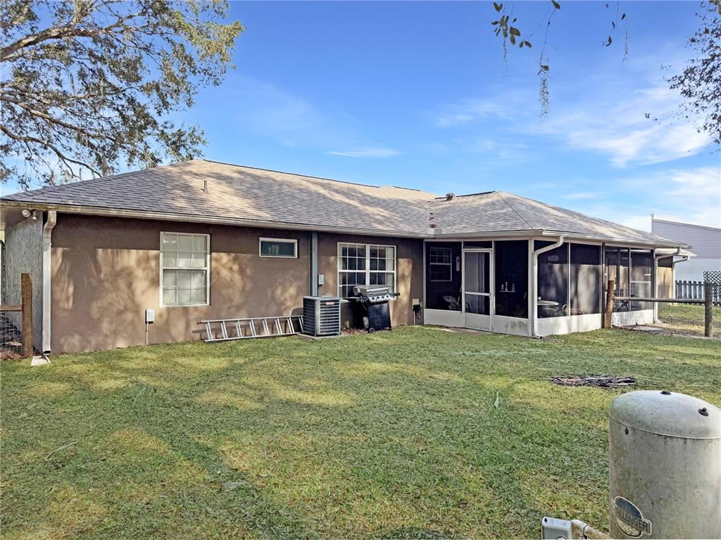 5730 Southeast 41st Street Ocala, FL 34480 - Photo 26 of 27 a front view of a house with a garden