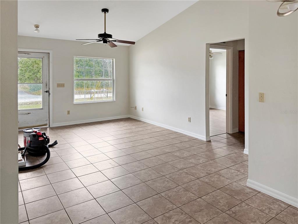 5730 Southeast 41st Street Ocala, FL 34480 - Photo 4 of 27 a view of a livingroom with window