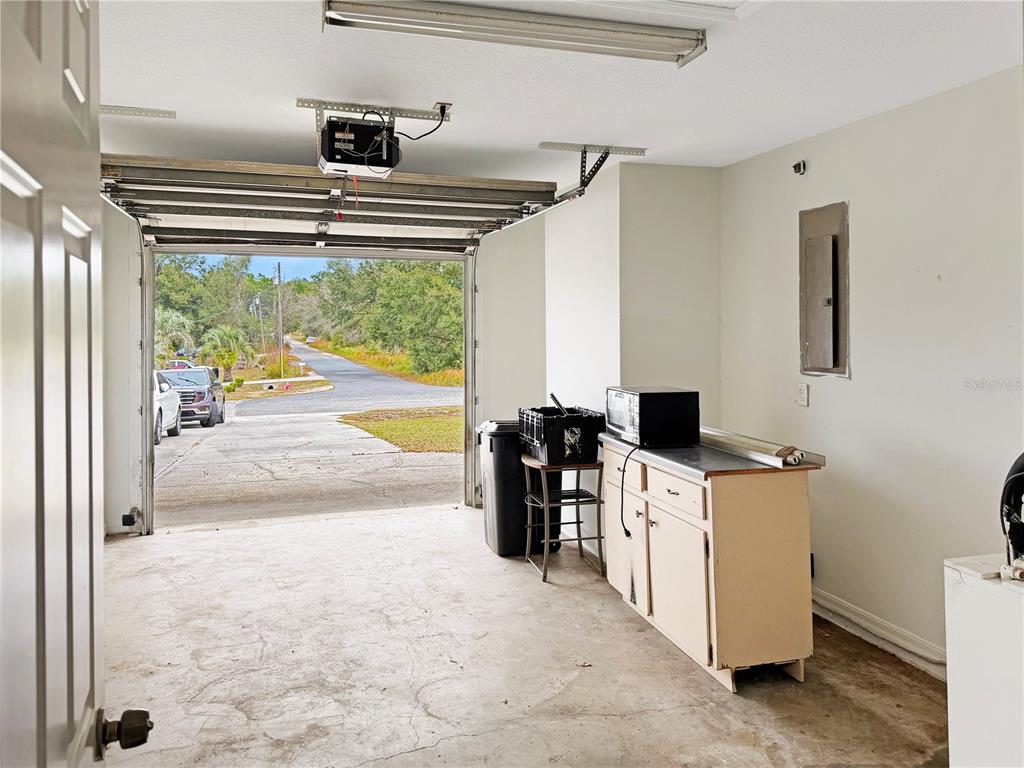 5730 Southeast 41st Street Ocala, FL 34480 - Photo 10 of 27 a kitchen that has a lot of white cabinets