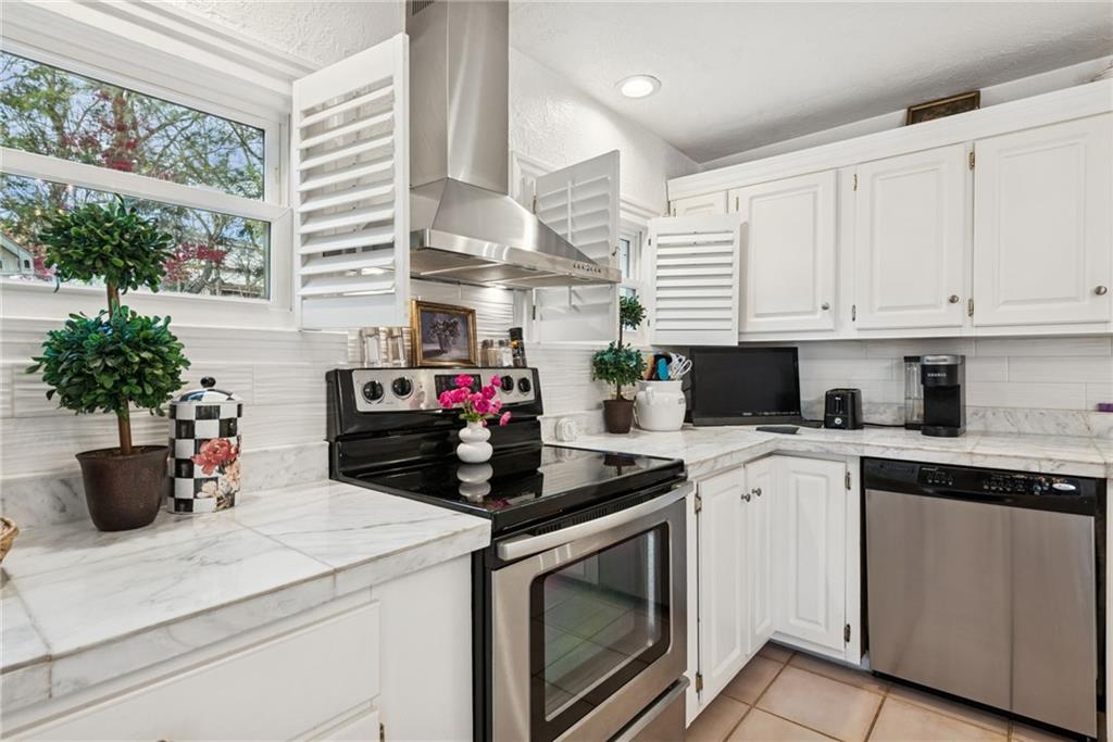 3024 Hyland Road Irwin, PA 15642 - Photo 21 of 45 a kitchen with a stove and white cabinets