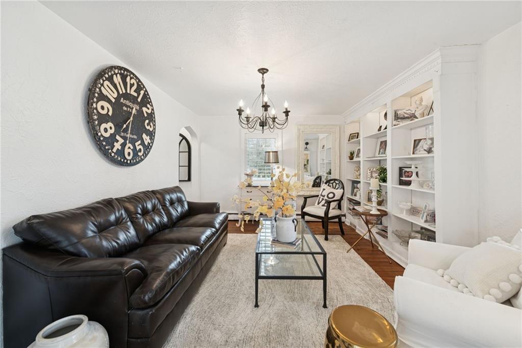 3024 Hyland Road Irwin, PA 15642 - Photo 27 of 45 a living room with furniture flowerpot and a chandelier