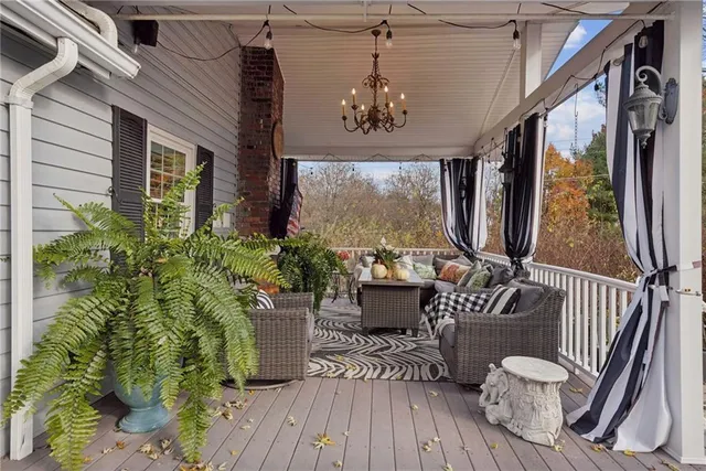 a view of a balcony with furniture