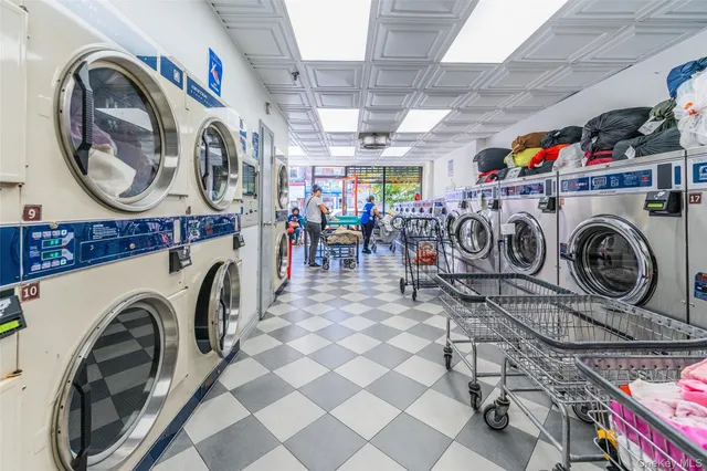 a view of a storage utility in a utility room with washer and dryer