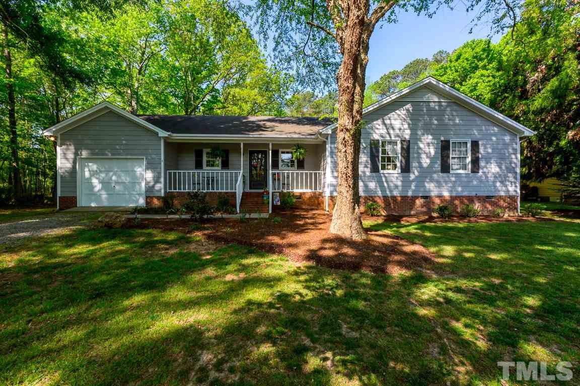 2101 Howson Road Raleigh, NC 27603 - Photo 1 of 25 a front view of a house with a yard