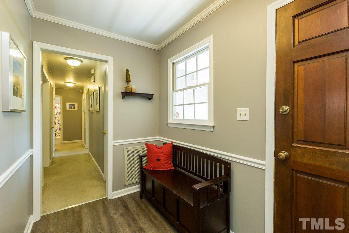 2101 Howson Road Raleigh, NC 27603 - Photo 11 of 25 a view of a hallway with entryway and wooden floor