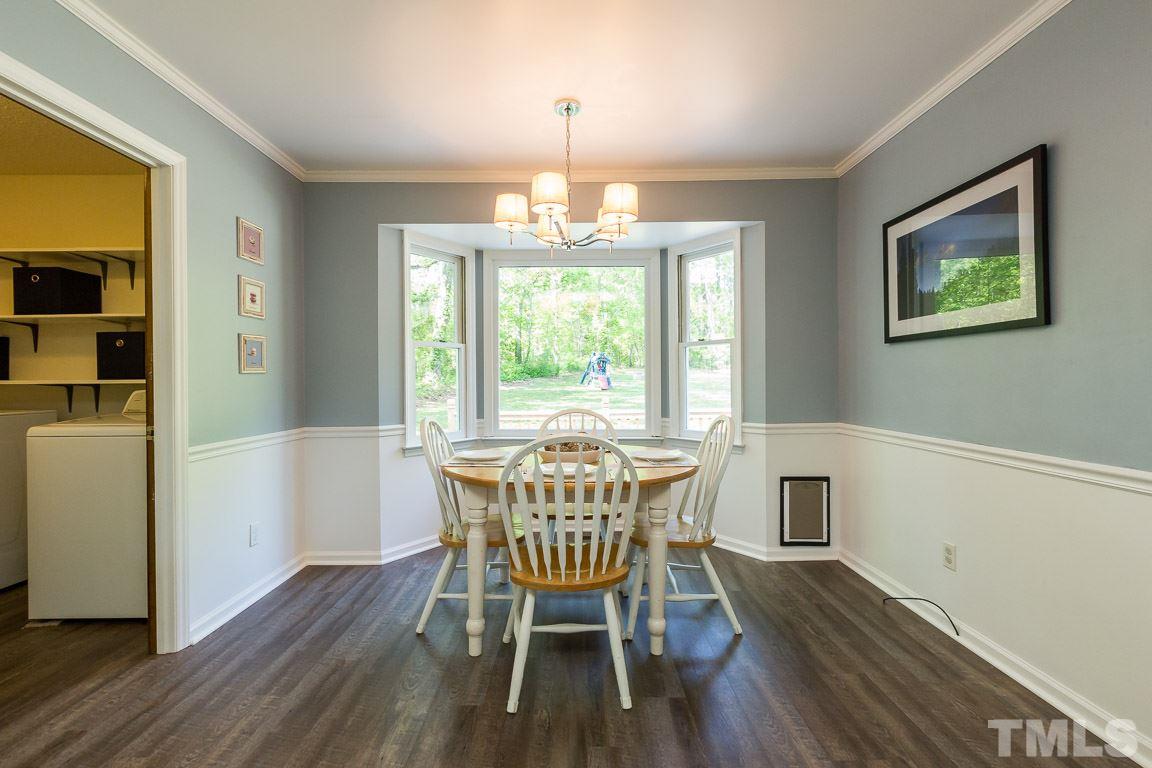 2101 Howson Road Raleigh, NC 27603 - Photo 17 of 25 a view of a dining room with furniture window and wooden floor
