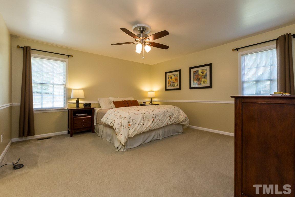 2101 Howson Road Raleigh, NC 27603 - Photo 18 of 25 a bedroom with a bed and a window