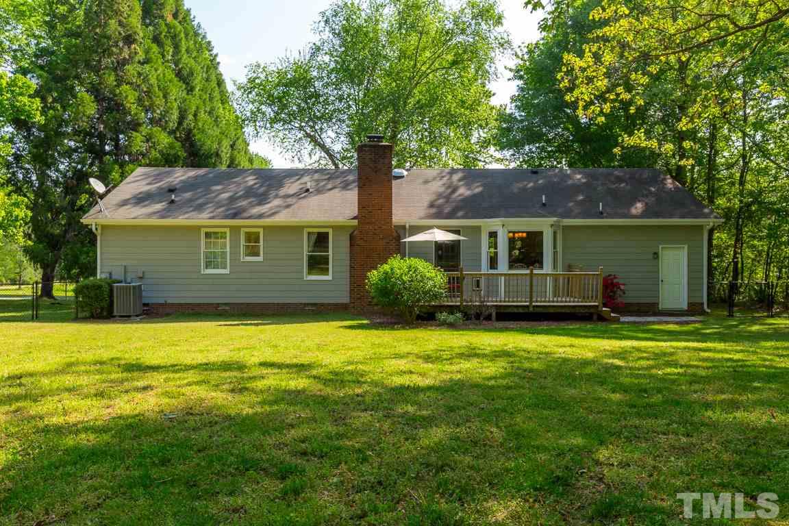 2101 Howson Road Raleigh, NC 27603 - Photo 7 of 25 a front view of a house with a garden