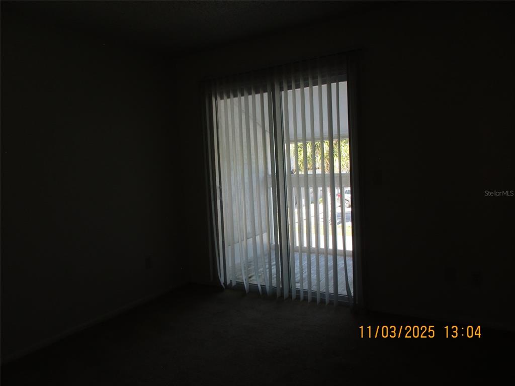 291 Flower Lane, Unit A Kissimmee, FL 34743 - Photo 16 of 40 a view of outdoor space and a window