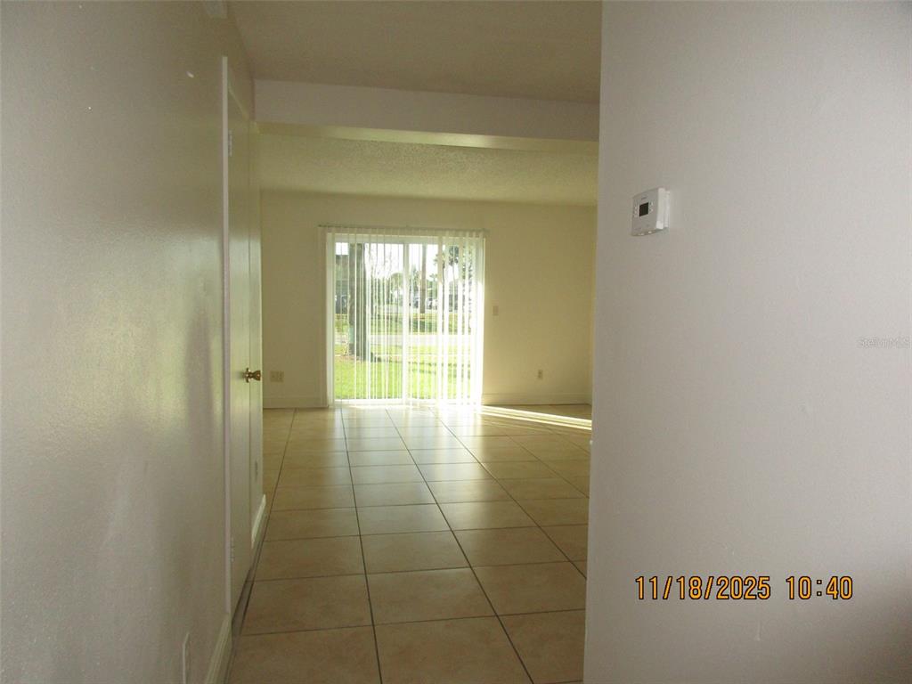 291 Flower Lane, Unit A Kissimmee, FL 34743 - Photo 21 of 40 a view of an empty room and window