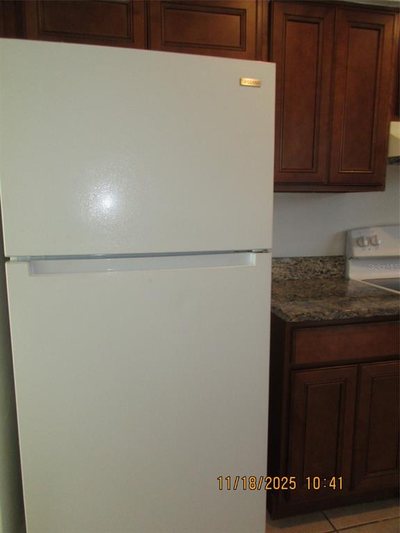 291 Flower Lane, Unit A Kissimmee, FL 34743 - Photo 25 of 40 a utility room with dryer and washer