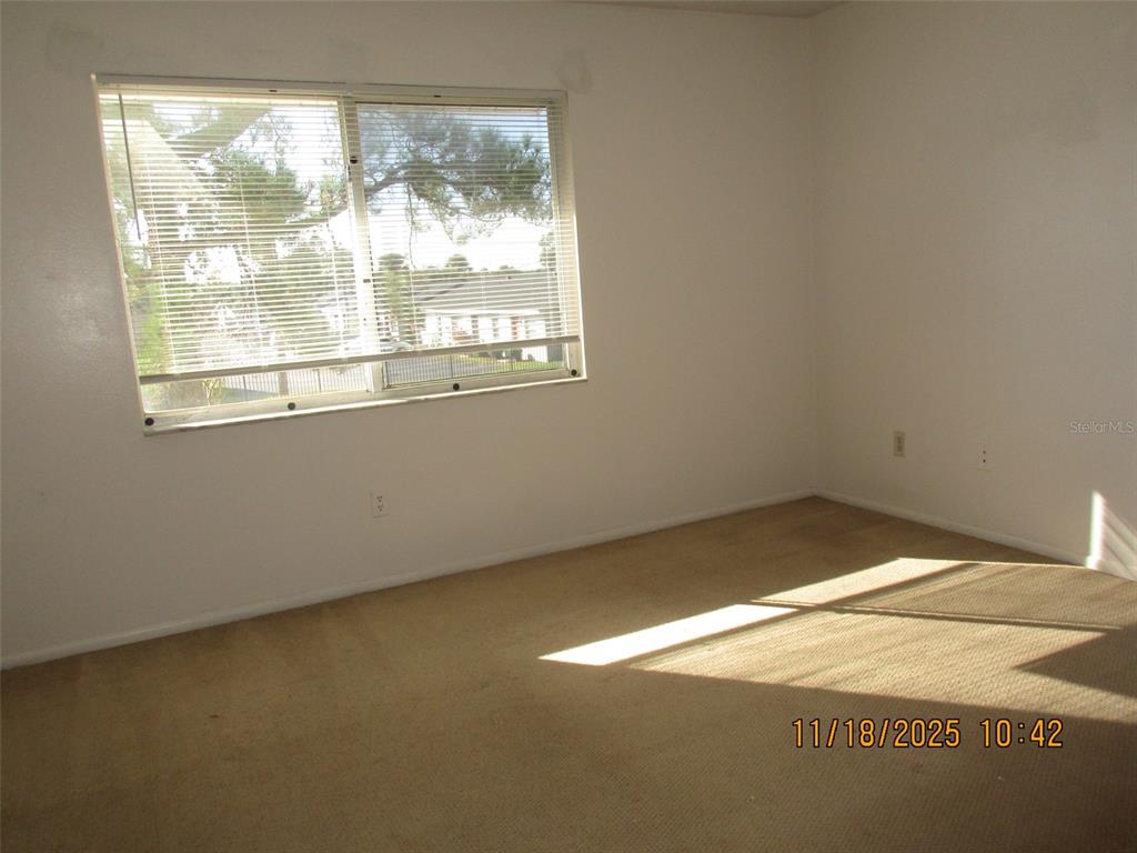 291 Flower Lane, Unit A Kissimmee, FL 34743 - Photo 31 of 40 a view of a room with a window