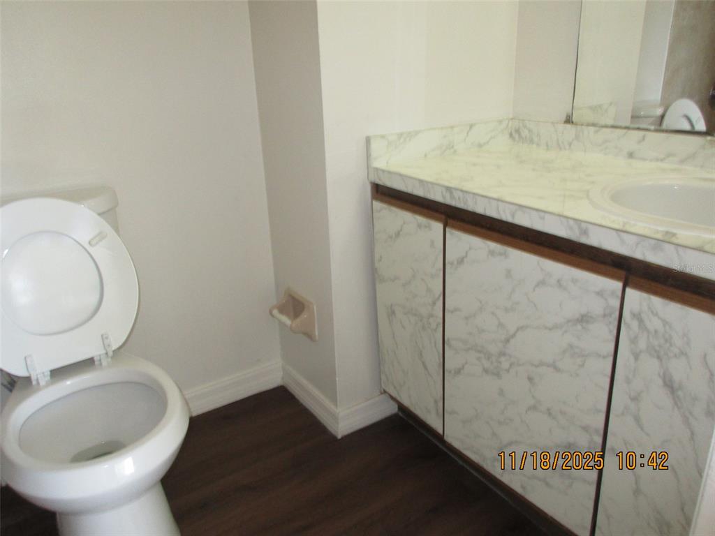 291 Flower Lane, Unit A Kissimmee, FL 34743 - Photo 33 of 40 a bathroom with a sink and a toilet