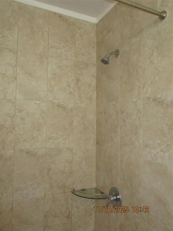 291 Flower Lane, Unit A Kissimmee, FL 34743 - Photo 35 of 40 a bathroom with a shower