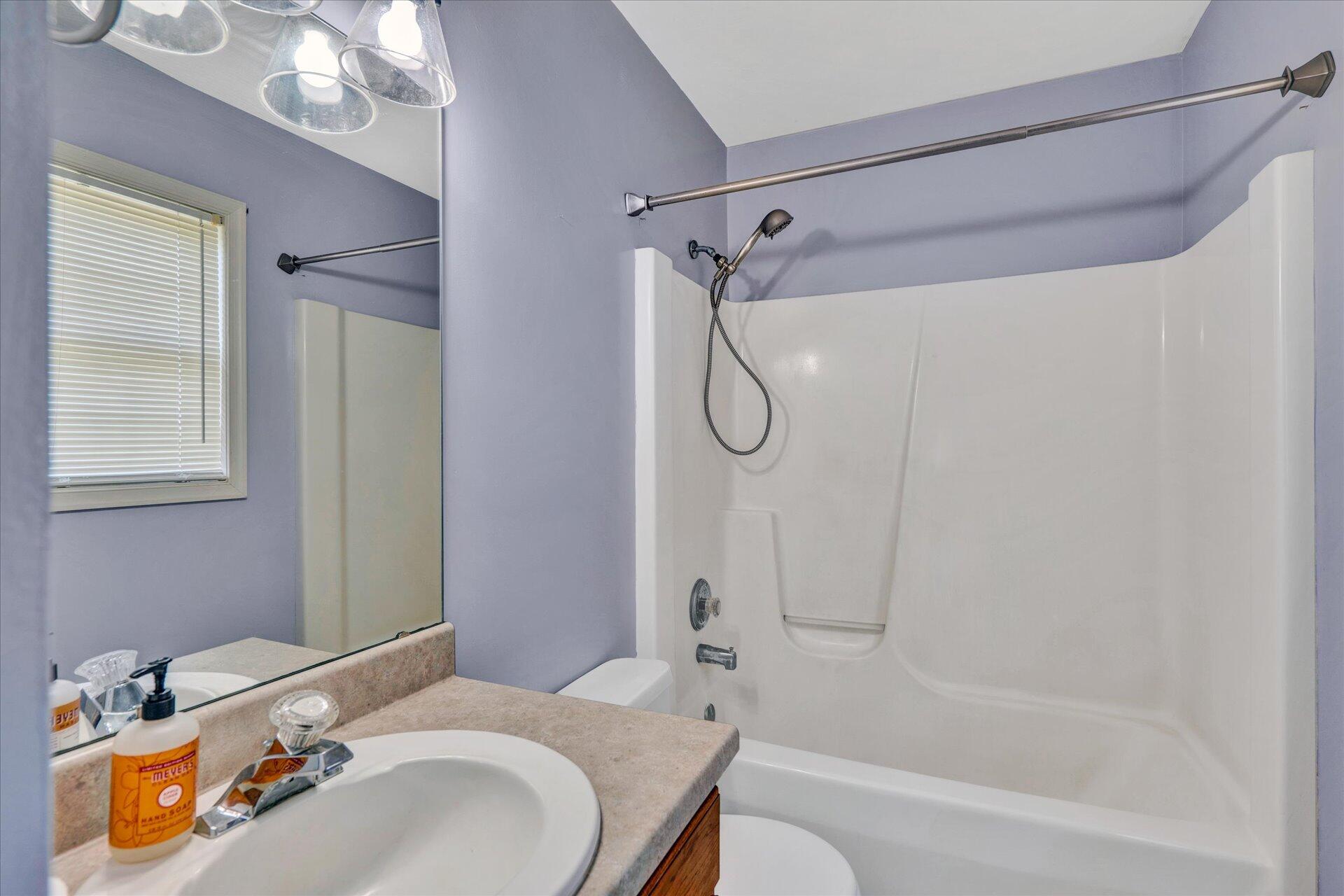 1306 Turner Branch Road Goodview, VA 24095 - Photo 11 of 21 a bathroom with a sink a toilet and shower