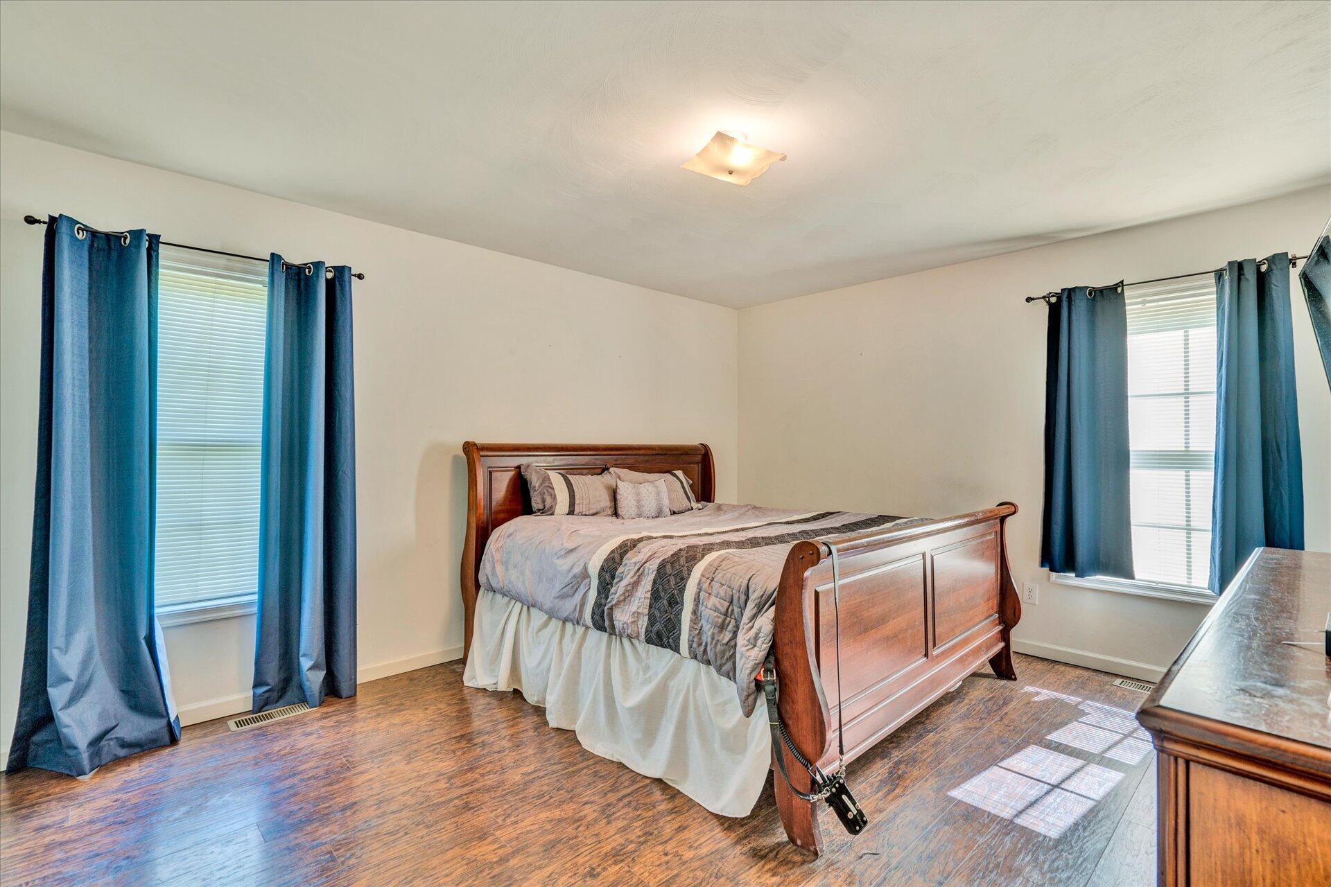 1306 Turner Branch Road Goodview, VA 24095 - Photo 12 of 21 a bedroom with a bed and window