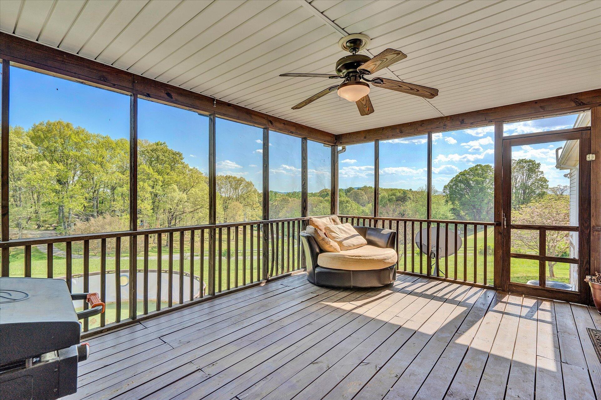 1306 Turner Branch Road Goodview, VA 24095 - Photo 15 of 21 a balcony with wooden floor and furniture