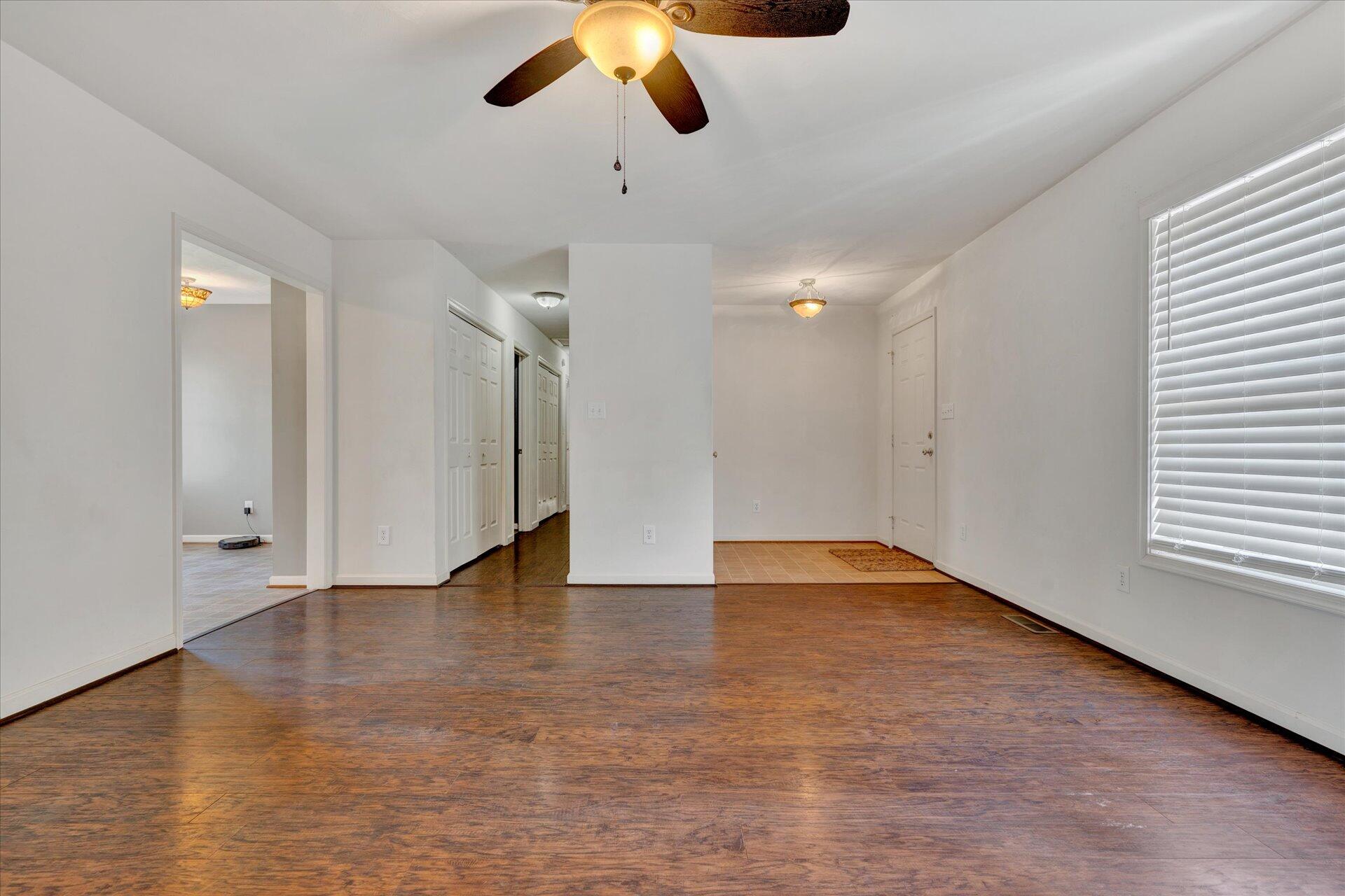 1306 Turner Branch Road Goodview, VA 24095 - Photo 5 of 21 wooden floor in an empty room with a window