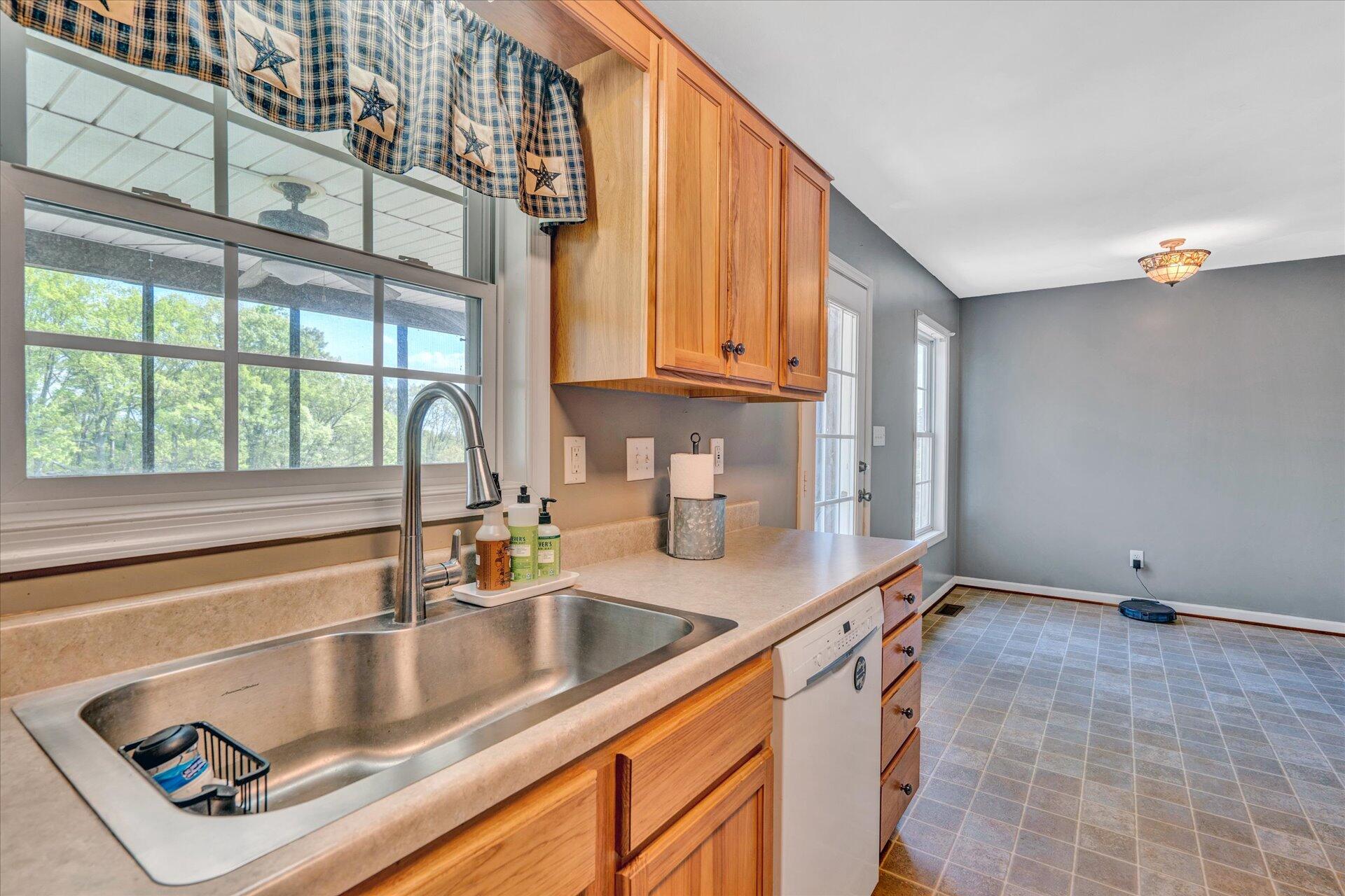 1306 Turner Branch Road Goodview, VA 24095 - Photo 8 of 21 a kitchen with a sink and a window