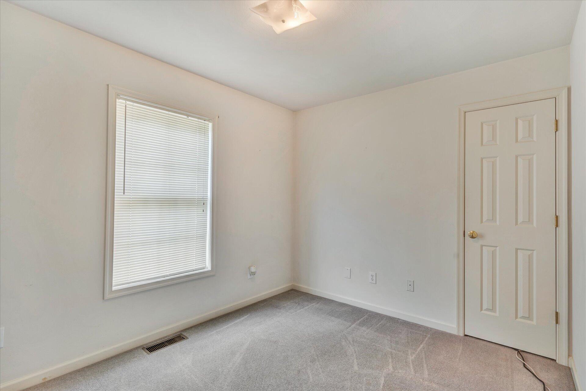 1306 Turner Branch Road Goodview, VA 24095 - Photo 9 of 21 an empty room with windows and closet