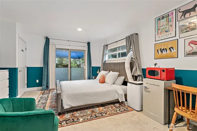 a bedroom with a bed and a table