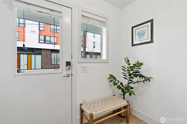 a view of an entryway with wooden floor