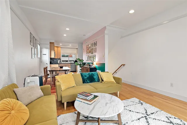 a living room with furniture and a rug