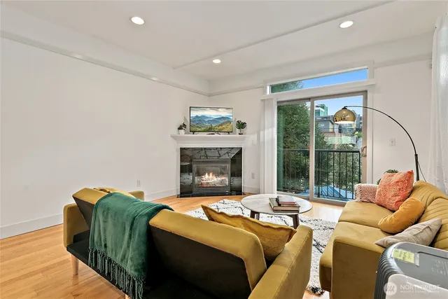 a living room with furniture and a fireplace