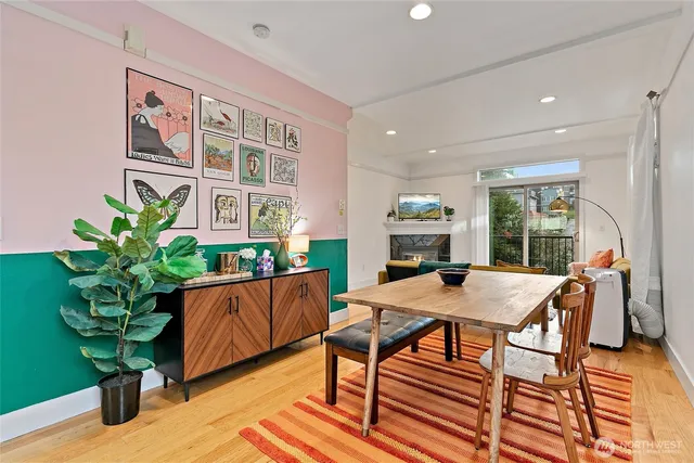 a view of a dining room with furniture window and wooden floor