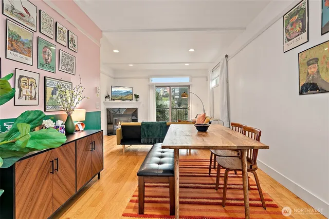 a view of a dining room with furniture window and wooden floor