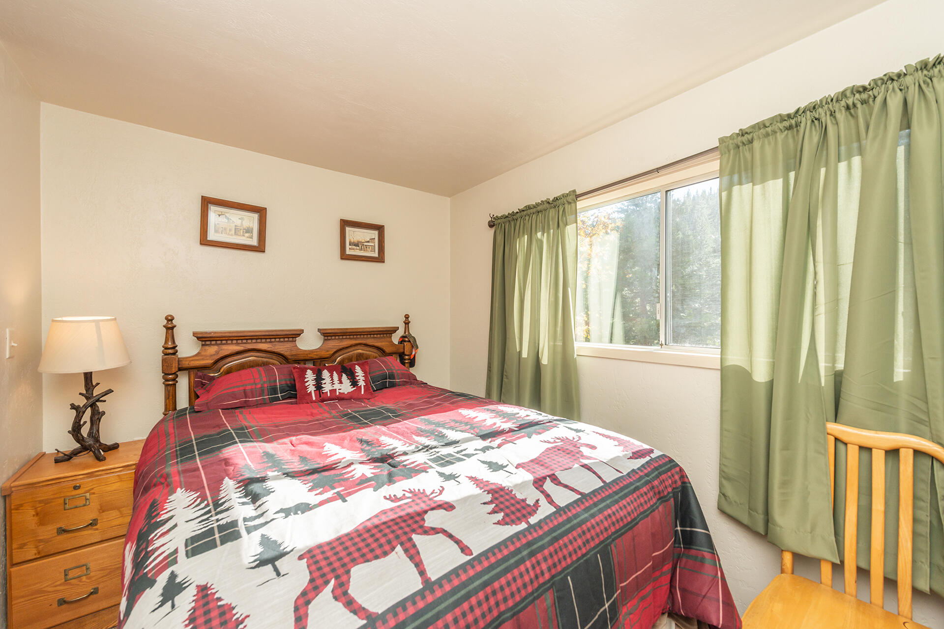 851 Mountain Aire Road Trinity Center, CA 96091 - Photo 42 of 54 a bedroom with a bed and a window