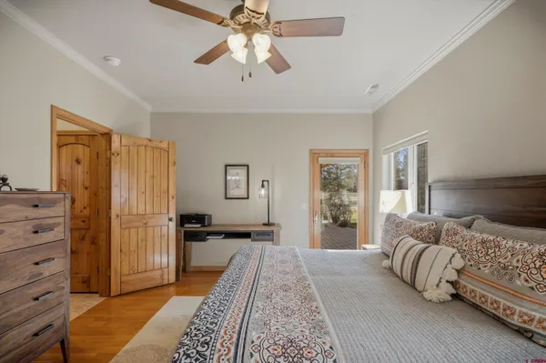 a en suite bathroom with a granite countertop sink a toilet and shower