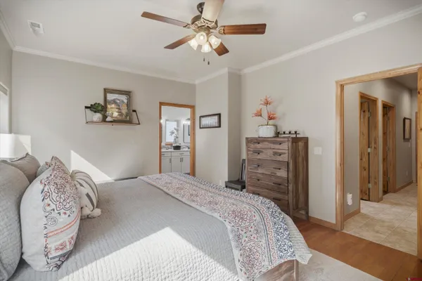 a bedroom with a bed and a chandelier