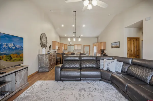 a kitchen with stainless steel appliances granite countertop a sink a stove and cabinets