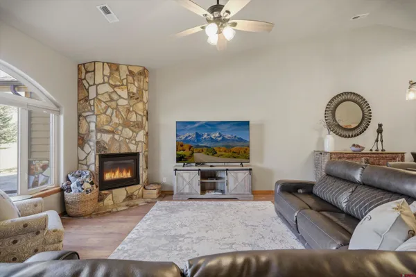 a kitchen with stainless steel appliances granite countertop a sink counter space cabinets and a large window