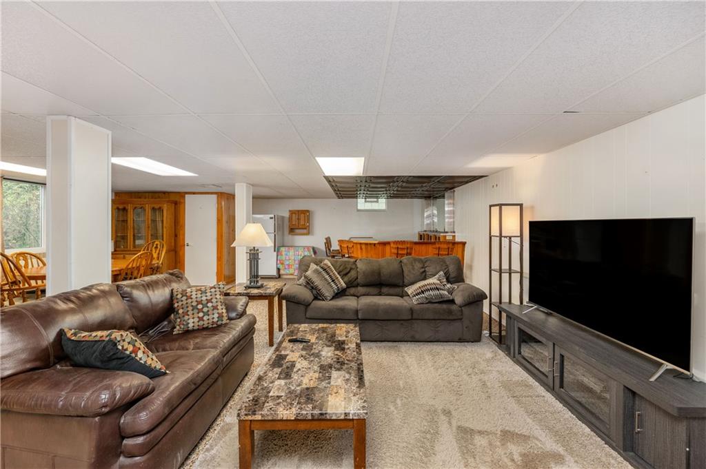 424 Brooks Road Wexford, PA 15090 - Photo 28 of 46 a living room with furniture and a flat screen tv
