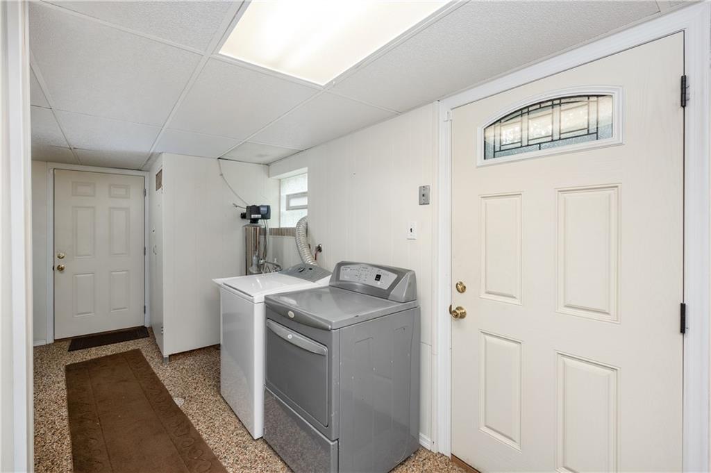 424 Brooks Road Wexford, PA 15090 - Photo 32 of 46 a utility room with cabinets washer and dryer