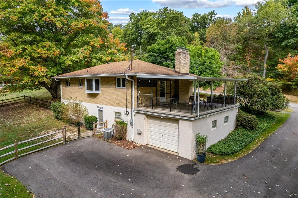 424 Brooks Road Wexford, PA 15090 - Photo 38 of 46 a white house covered with tall trees