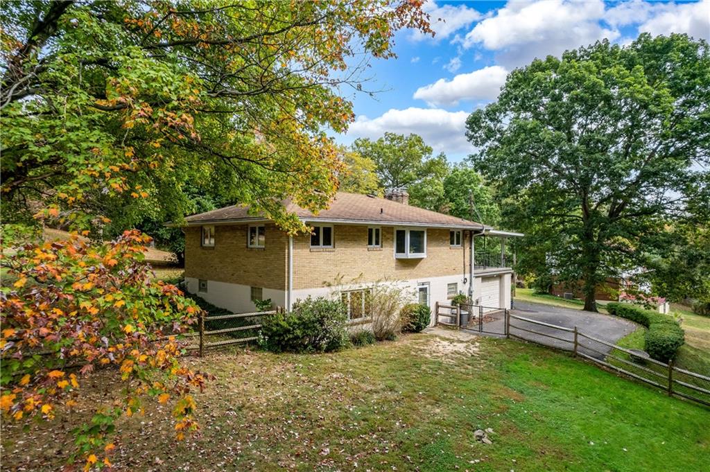 424 Brooks Road Wexford, PA 15090 - Photo 39 of 46 a front view of a house with a garden