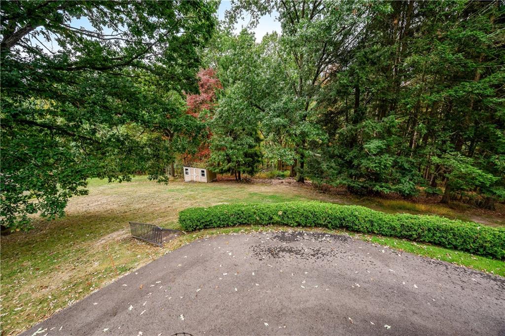 424 Brooks Road Wexford, PA 15090 - Photo 45 of 46 a view of a yard with plants and trees