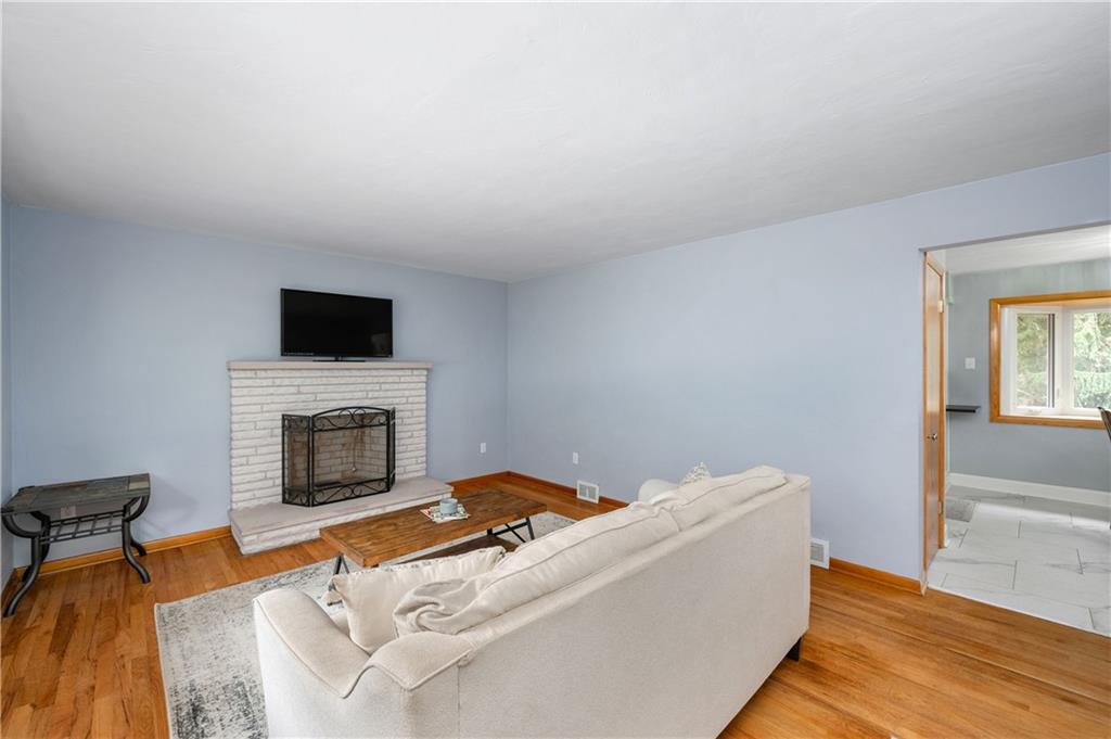424 Brooks Road Wexford, PA 15090 - Photo 7 of 46 a living room with furniture and a fireplace
