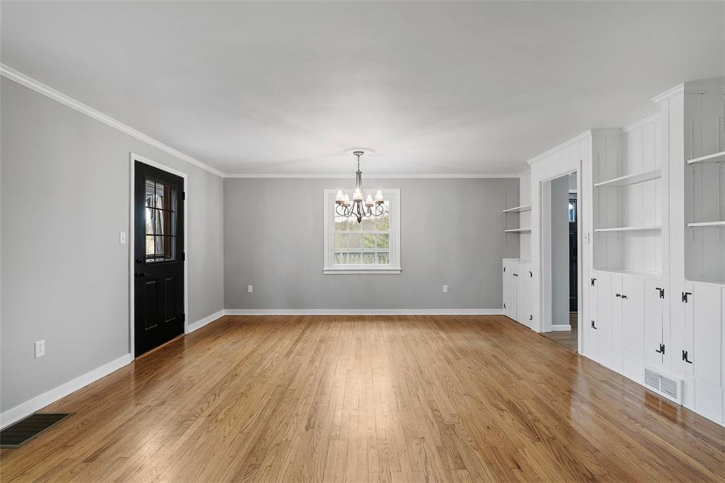 212 Old Rte 8 South Valencia, PA 16059 - Photo 20 of 47 an empty room with wooden floor cabinet and windows