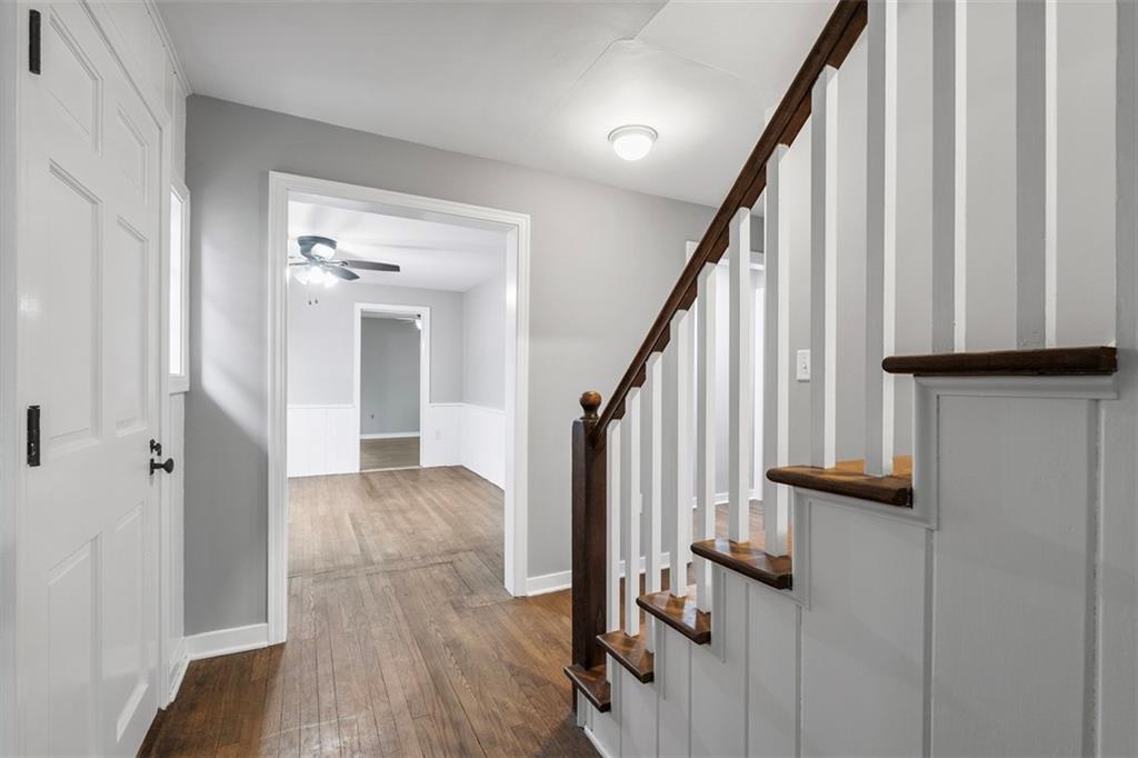 212 Old Rte 8 South Valencia, PA 16059 - Photo 6 of 47 a view of a hallway with wooden floor and staircase
