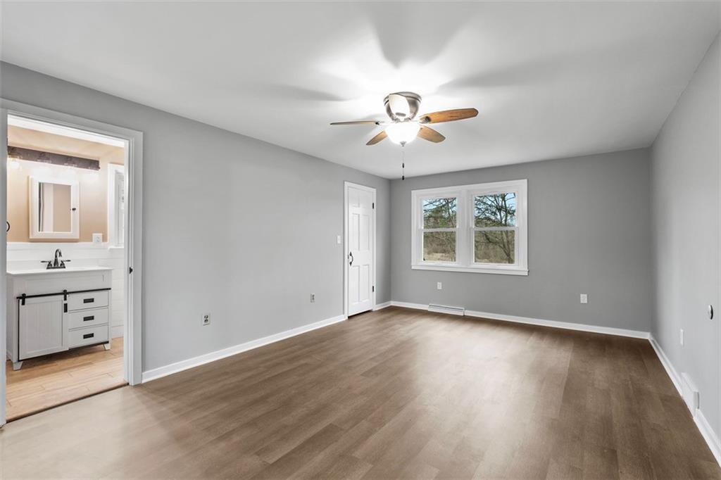 212 Old Rte 8 South Valencia, PA 16059 - Photo 8 of 47 a view of an empty room with a window and wooden floor